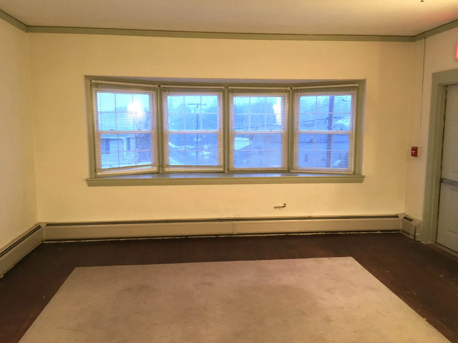 The "before picture." Century old plaster was in need of some TLC, and luckily the original floors could be brought back to life as well!