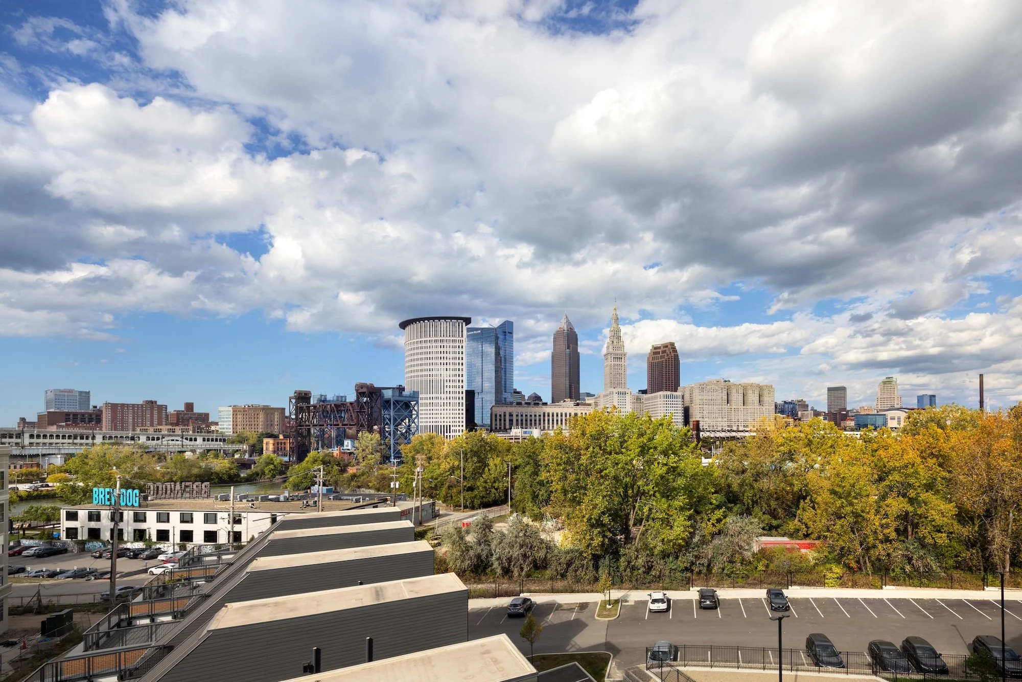 View of the Cleveland skyline from The Collins rooftop, showcasing the Cuyahoga River corridor, downtown landmarks, and the urban setting that connects the residential community to the city.