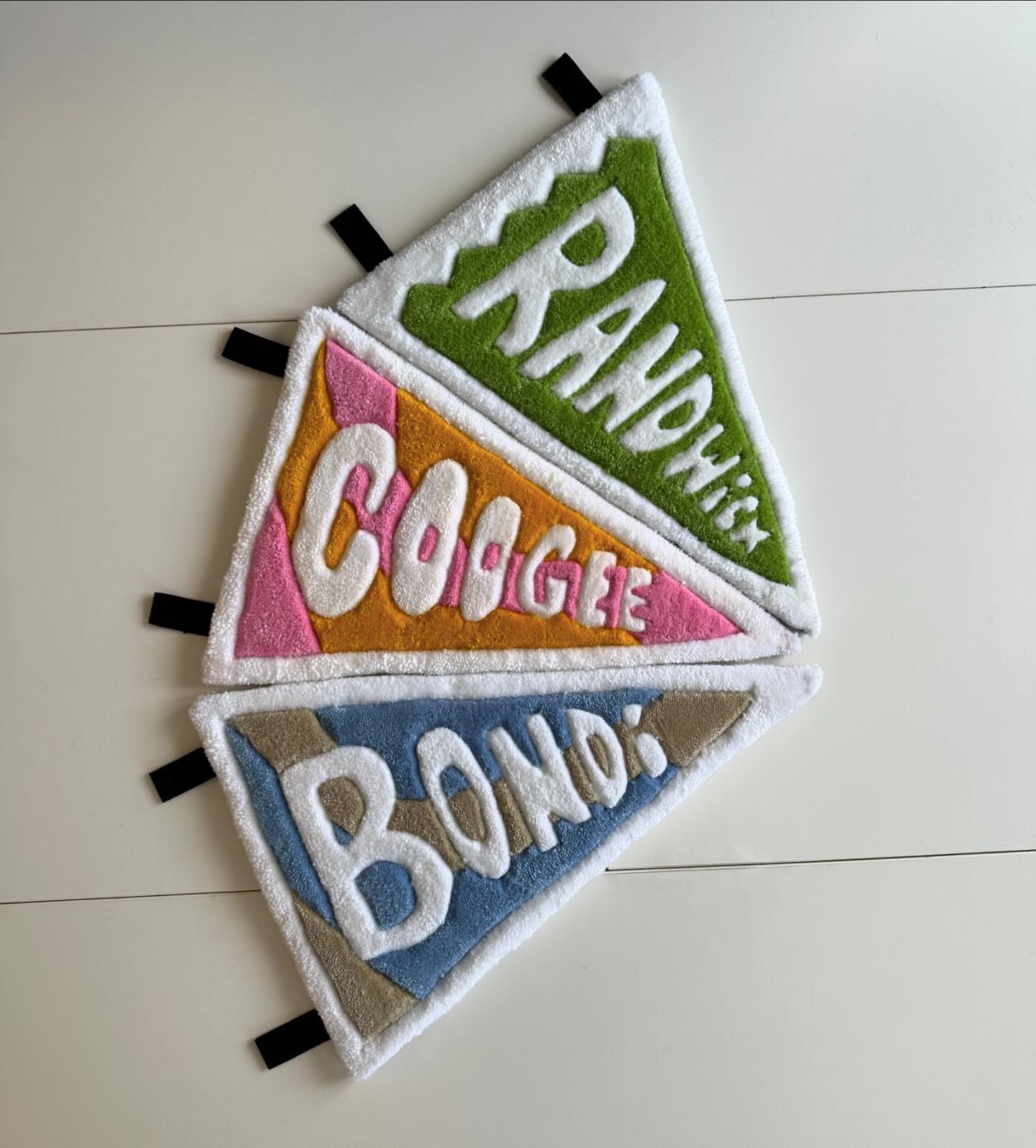 Pennant wall hanging rugs! 🚩

I&rsquo;ve wanted to hand make pennants for years, my room is covered in them hahaha it took me a while to realise I could just rugify some pennants and here we are. 
They are made with stiff felt backing to hold their 