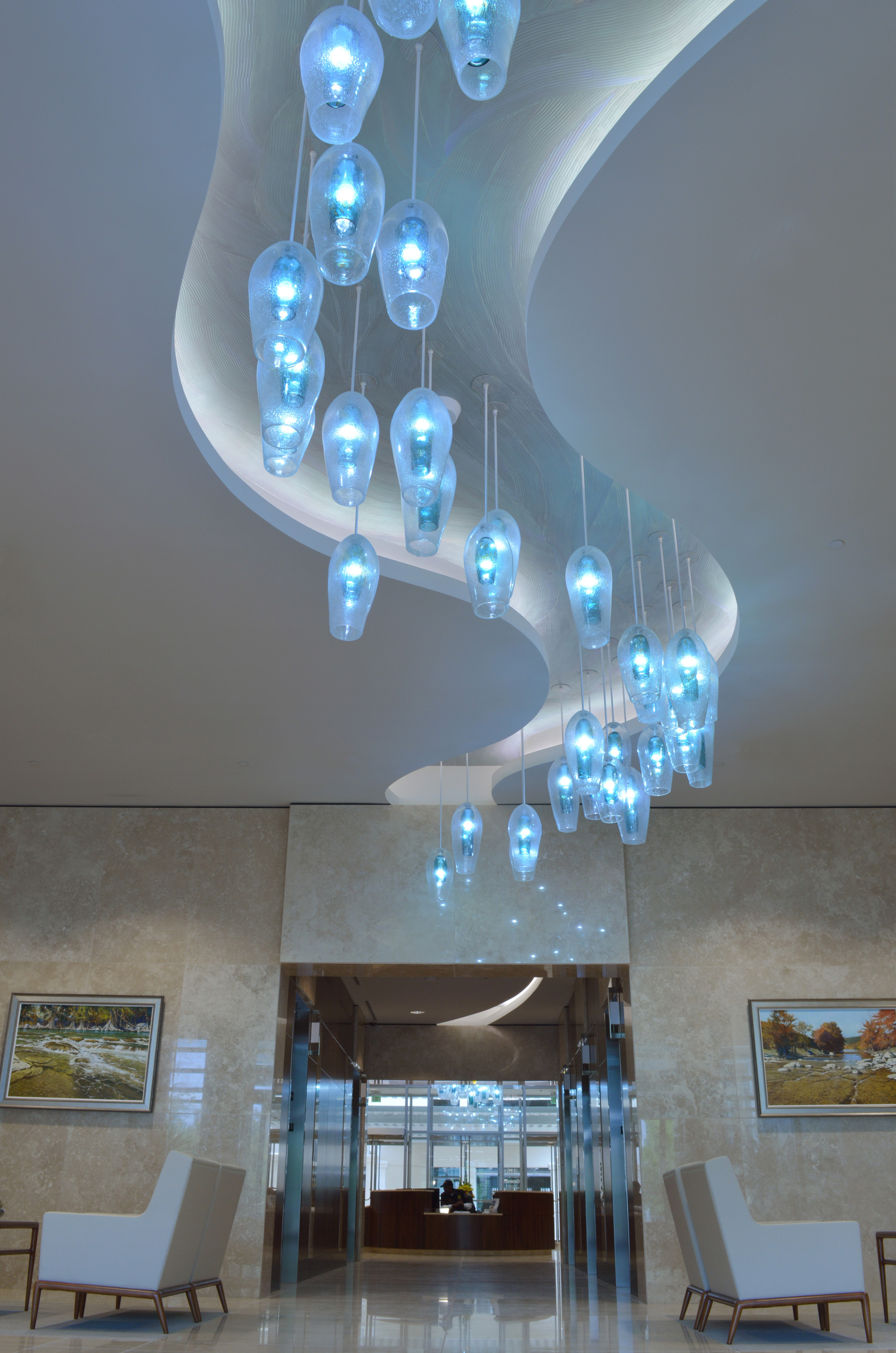 Wimberley Glassworks Briarpark Houston Blown Glass Lighting Installation through lobby shot for web (2).jpg