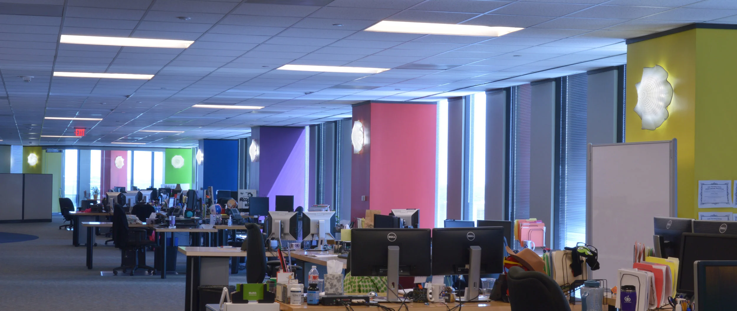 Art glass lighting used to create excitement in an open plan office space. See our Lighting Options