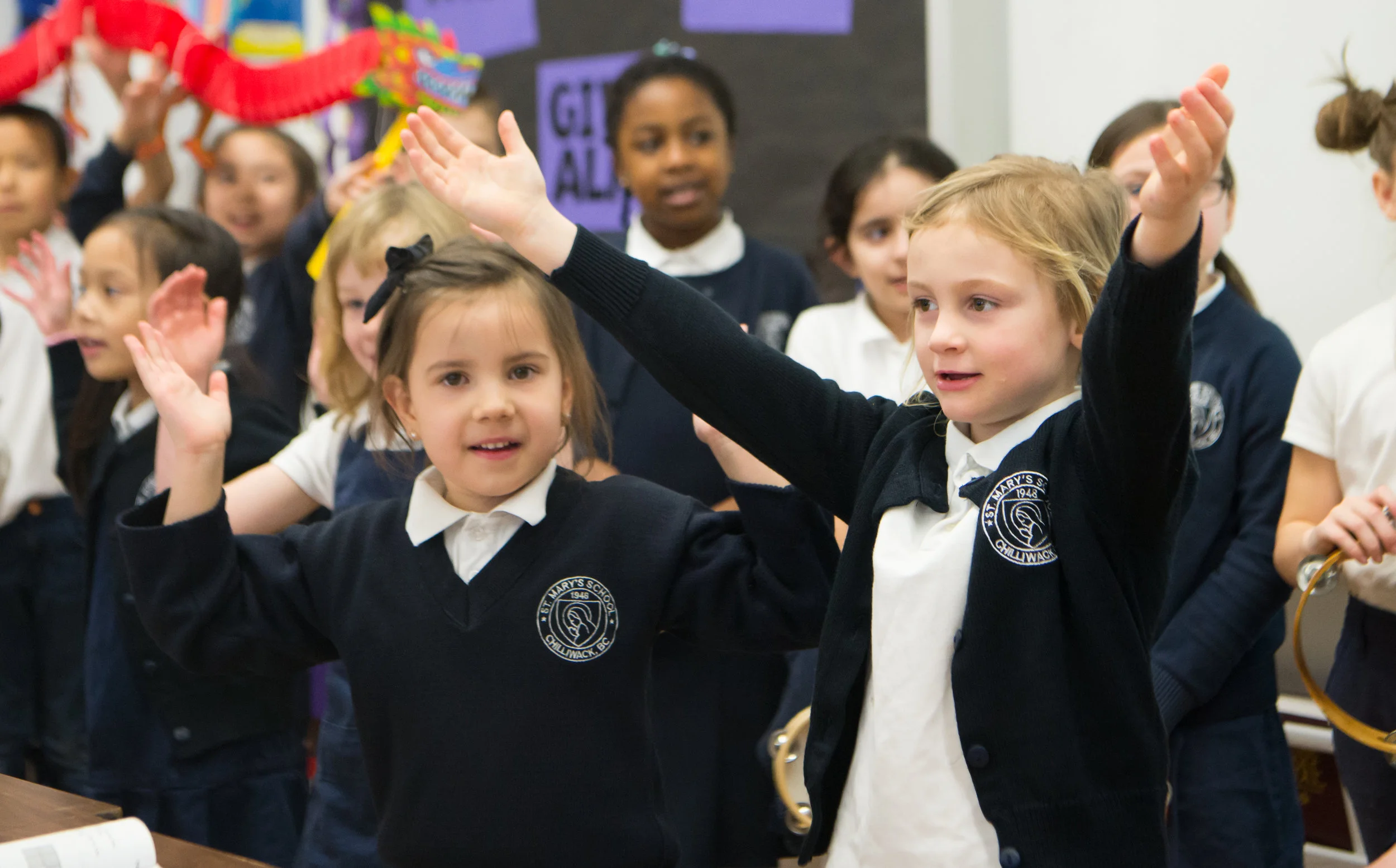 Children wearing the Saint Mary's School uniform.