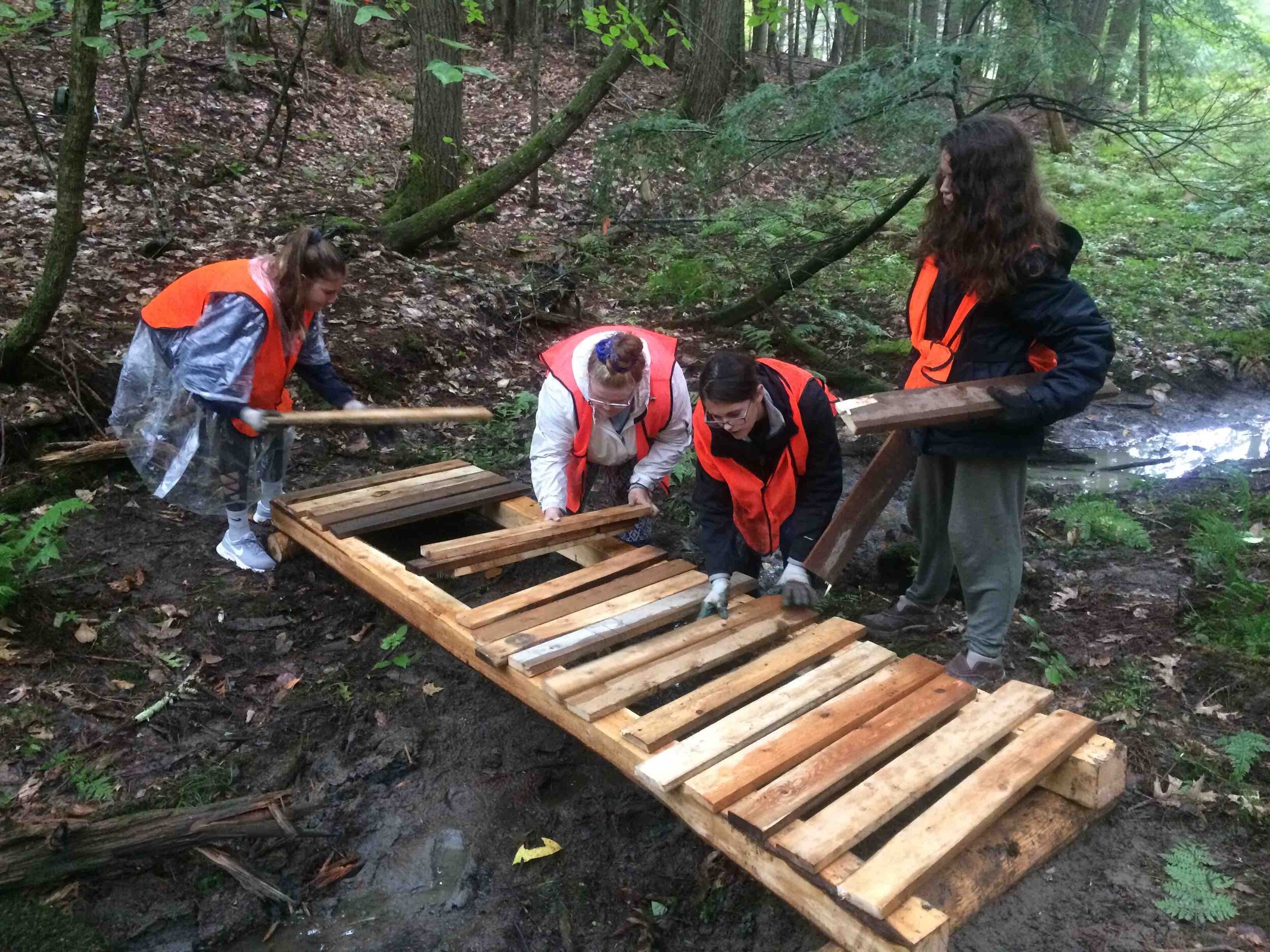  Bath Middle School students construct a replacement bridge on the Whiskeag Trail. 