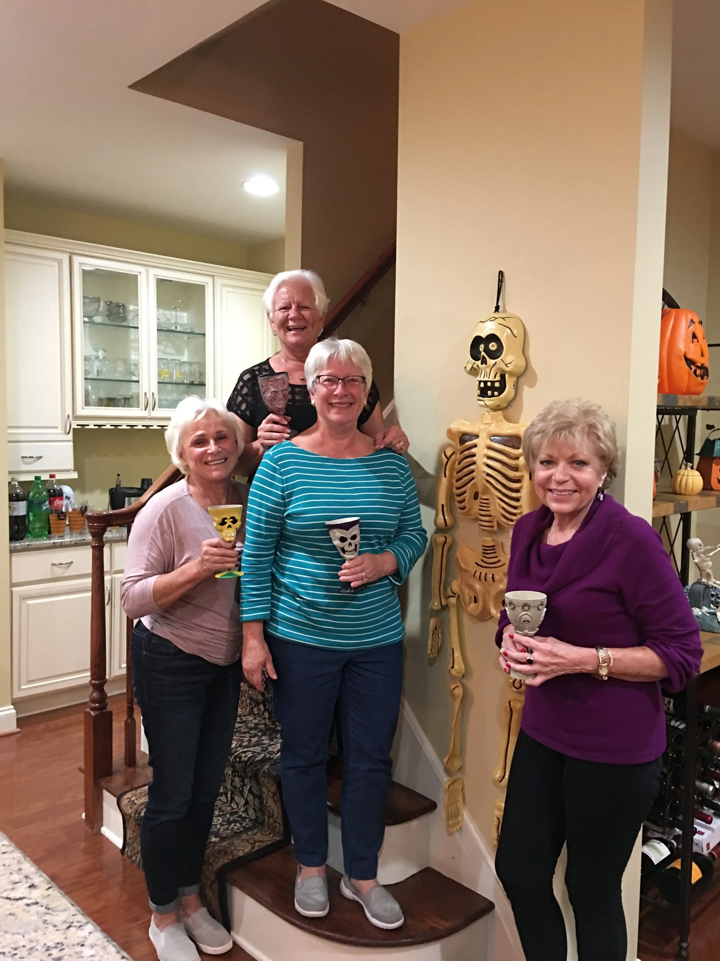 Our Halloween Meeting - part of the group. We haven't yet identified the classmate on the wall.