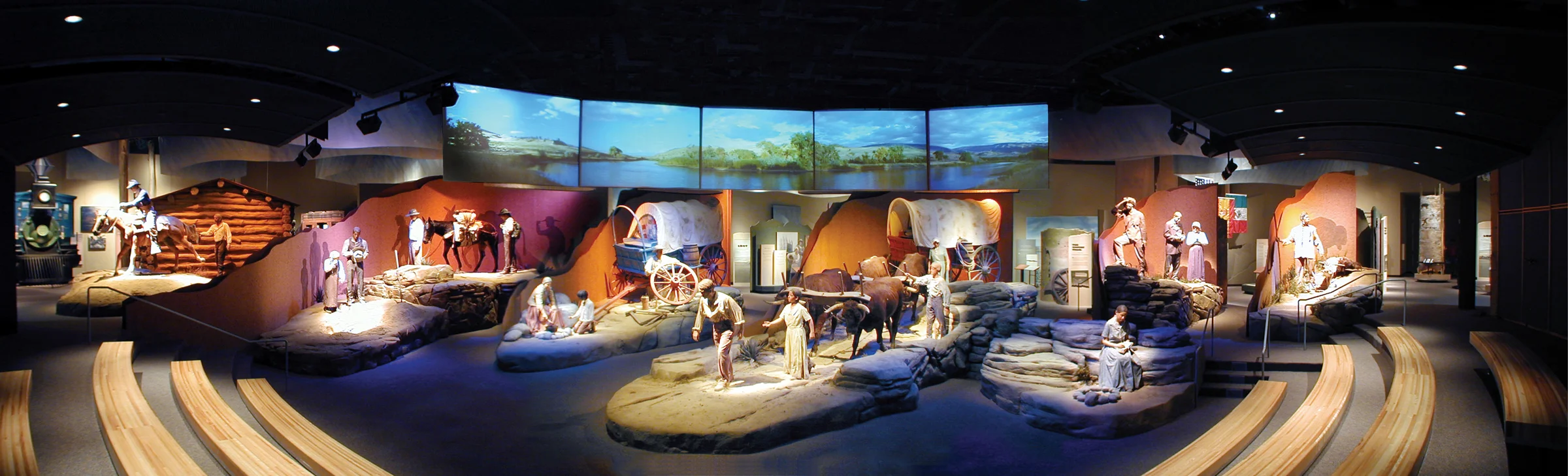 Visitors seated in the Orientation Theater experience the dramatic story of westward migration on the Oregon, Mormon, California, and Pony Express Trails through the use of life-size dioramas.
