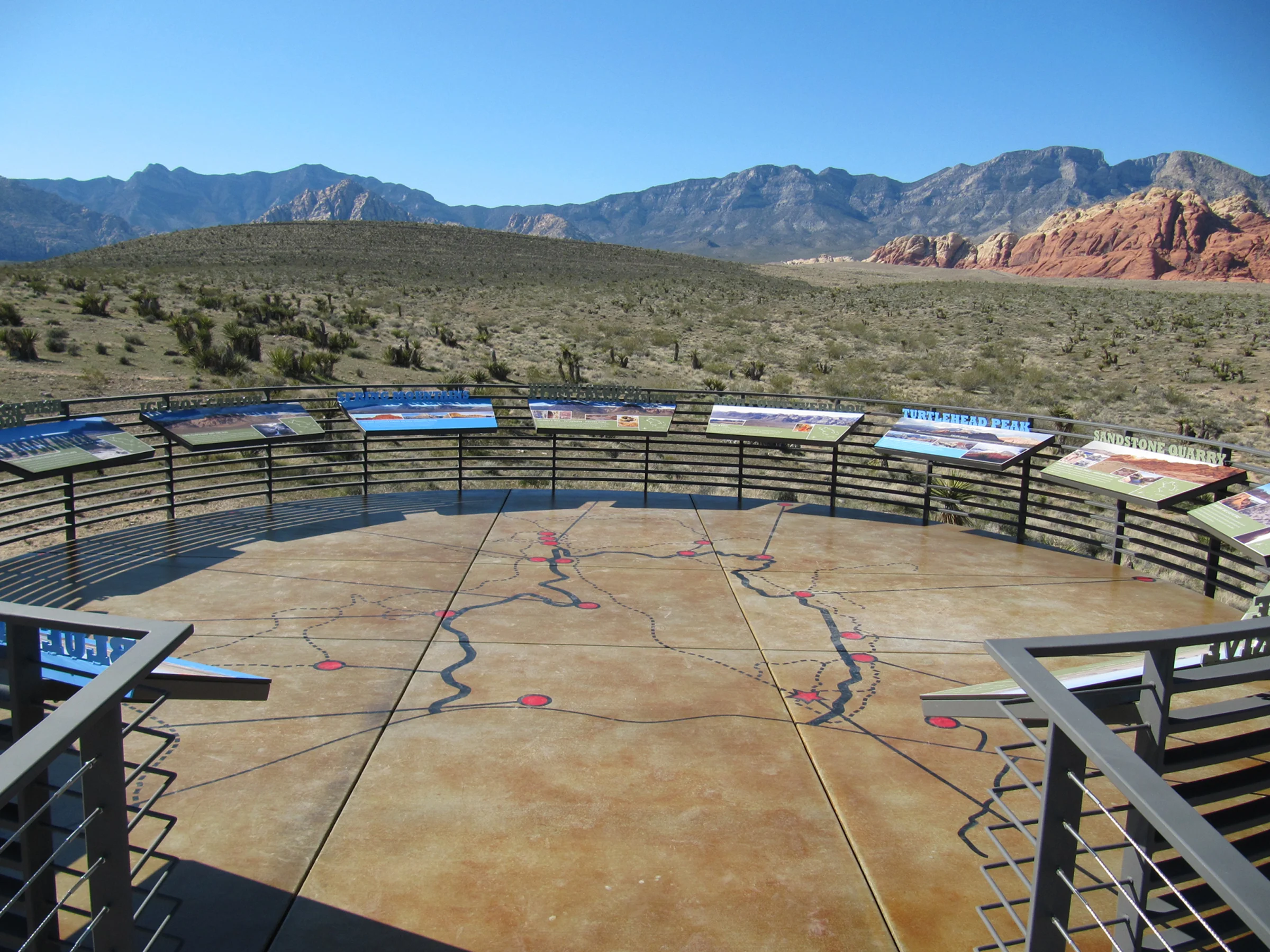 A walkway decorated with animal motifs from Native American legends leads to panels interpreting the landscape.