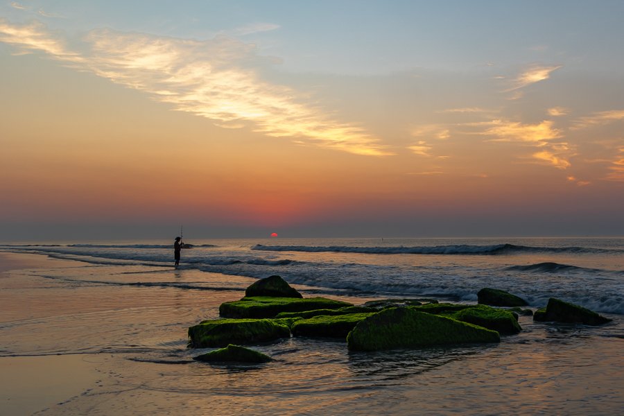 Lone Fisherman at Sunrise