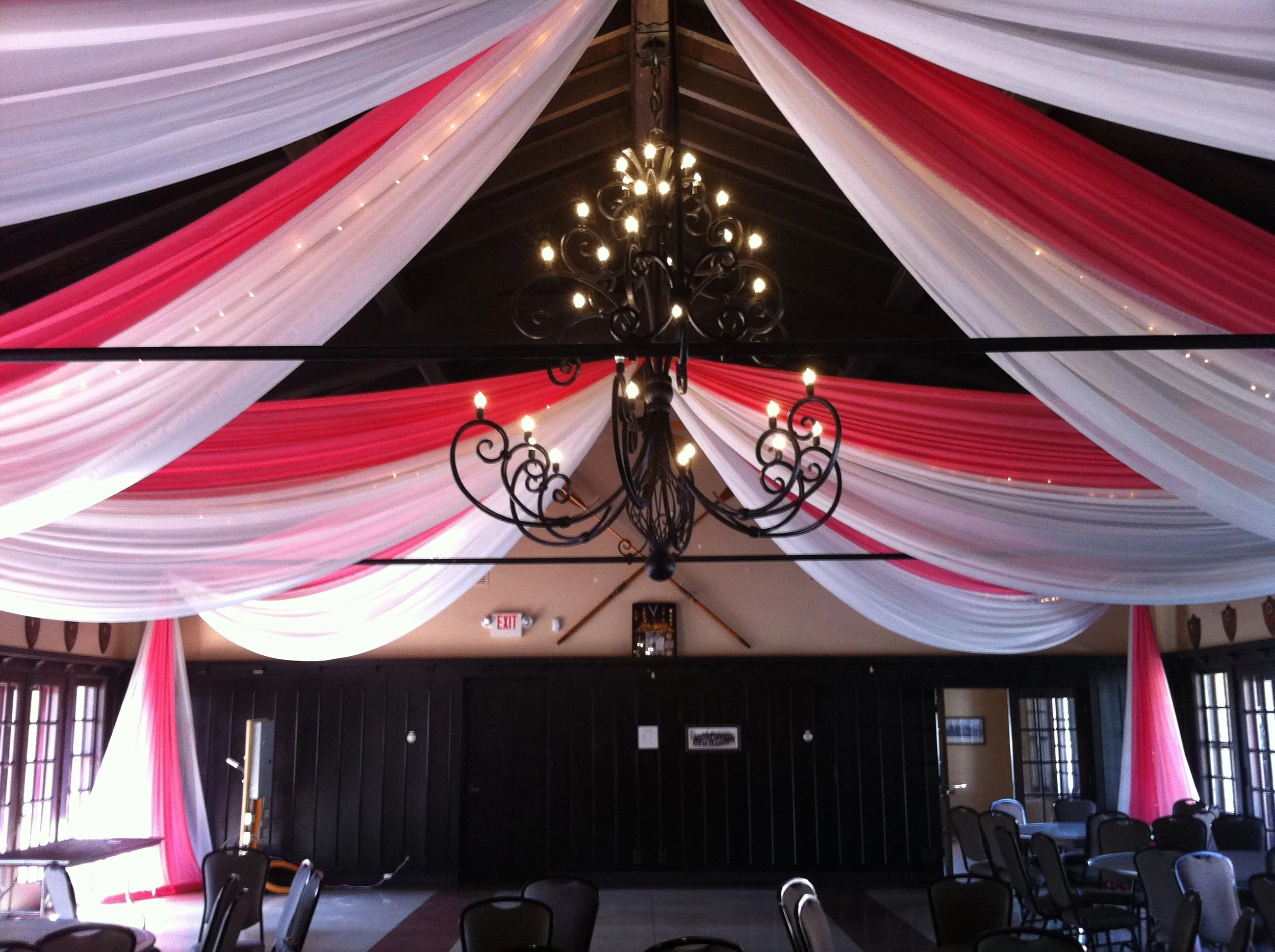 Red and white draping hung from the ceiling inside a Minnesota wedding venue