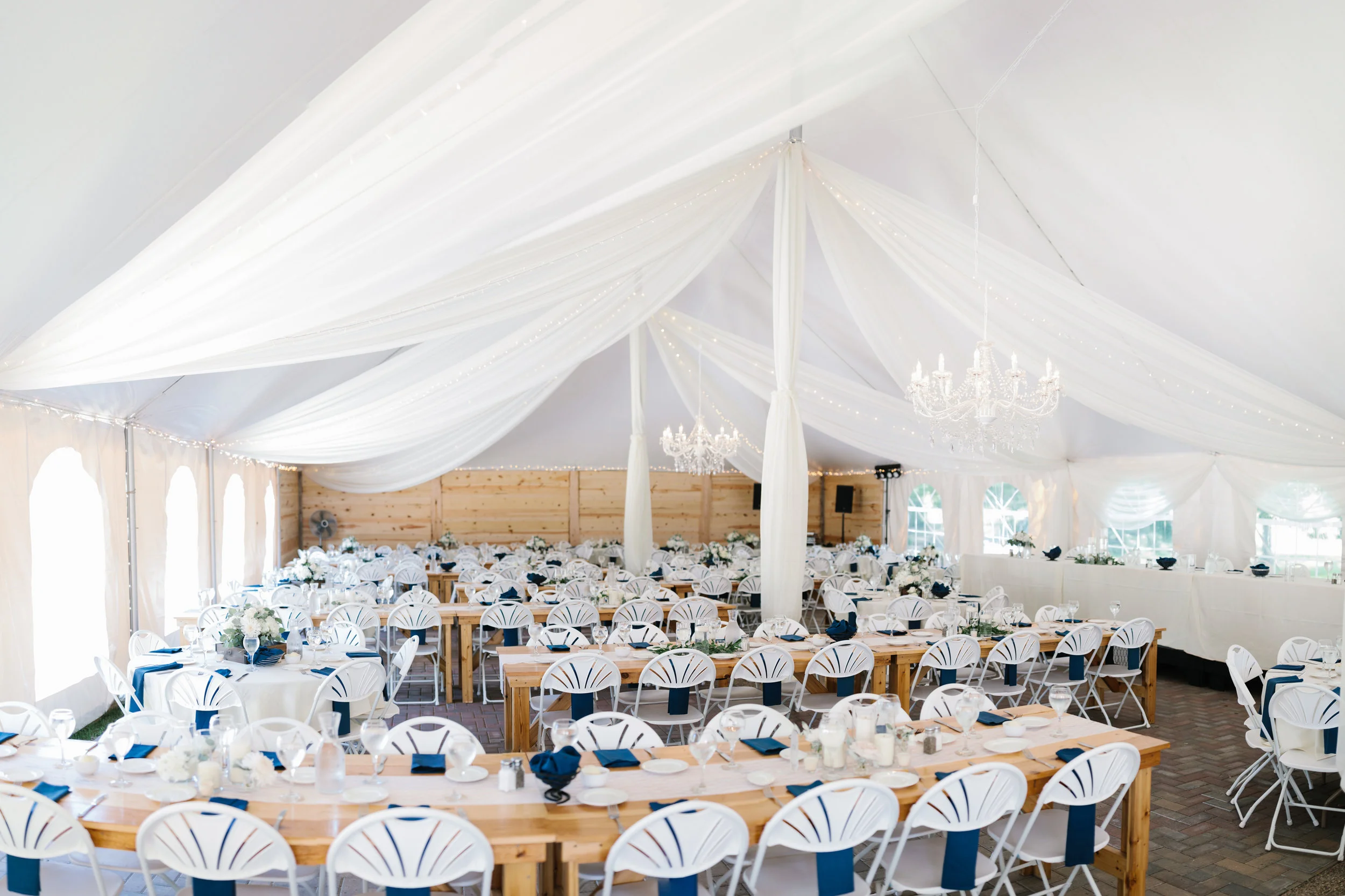classic white draping with two hanging chandeliers