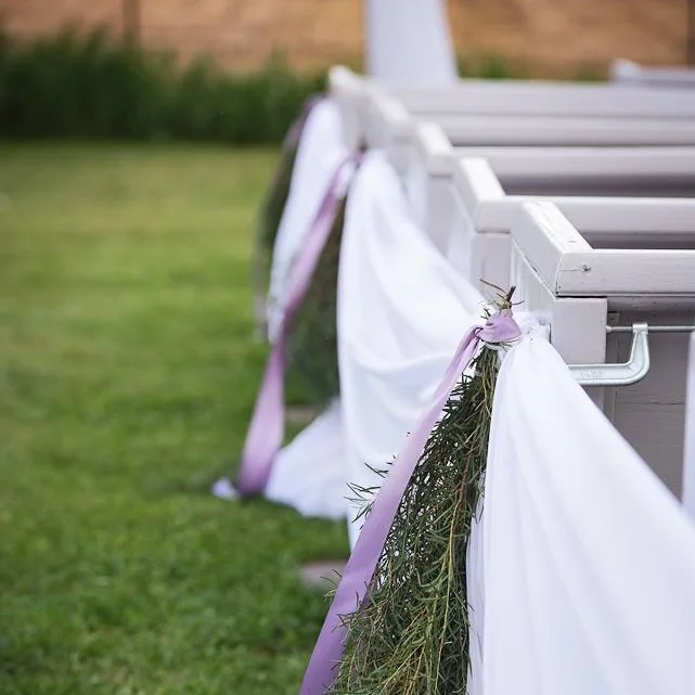 simple aisle draping with added greenery and ribbon