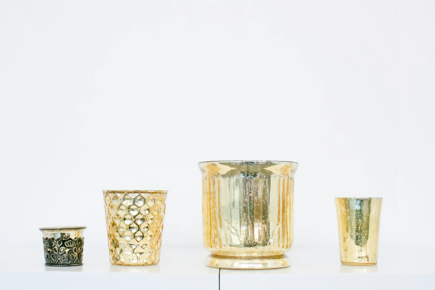 gold mercury glass vases and votives