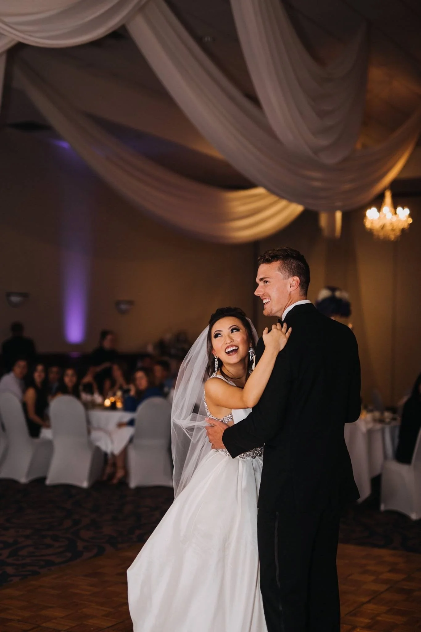 hanging eight light chandelier in wedding reception space