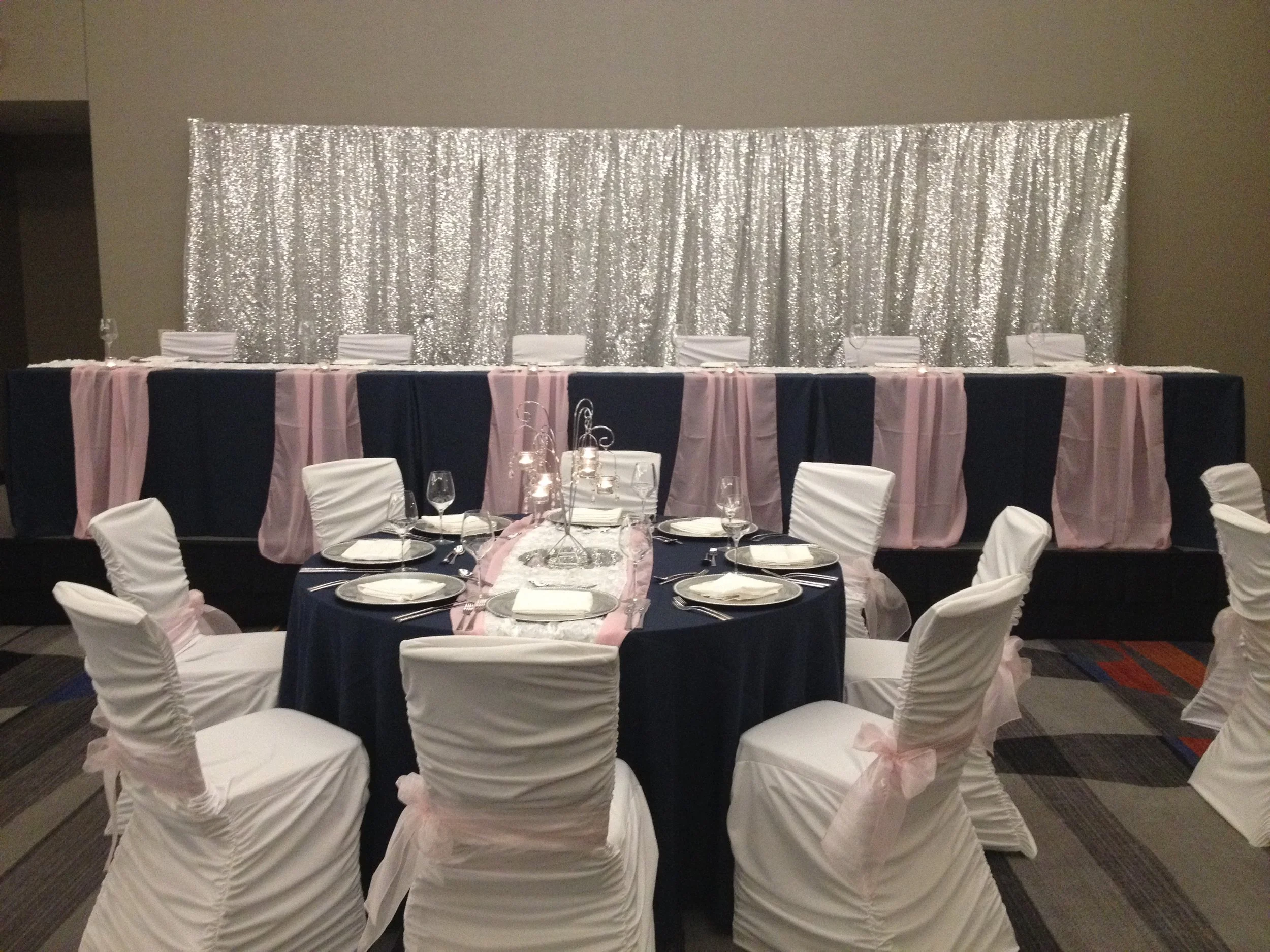 silver sequin backdrop behind head table for Minnesota wedding reception