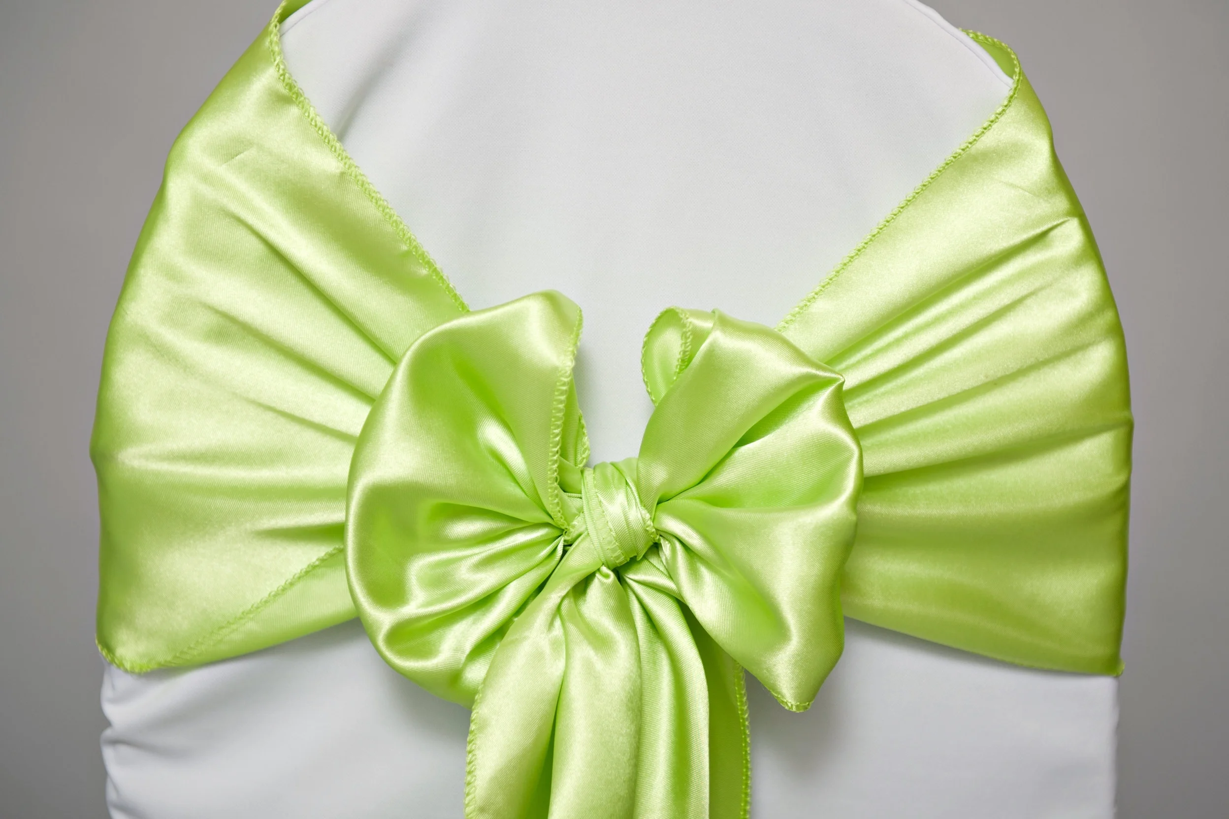 lime satin sash tied in a bow