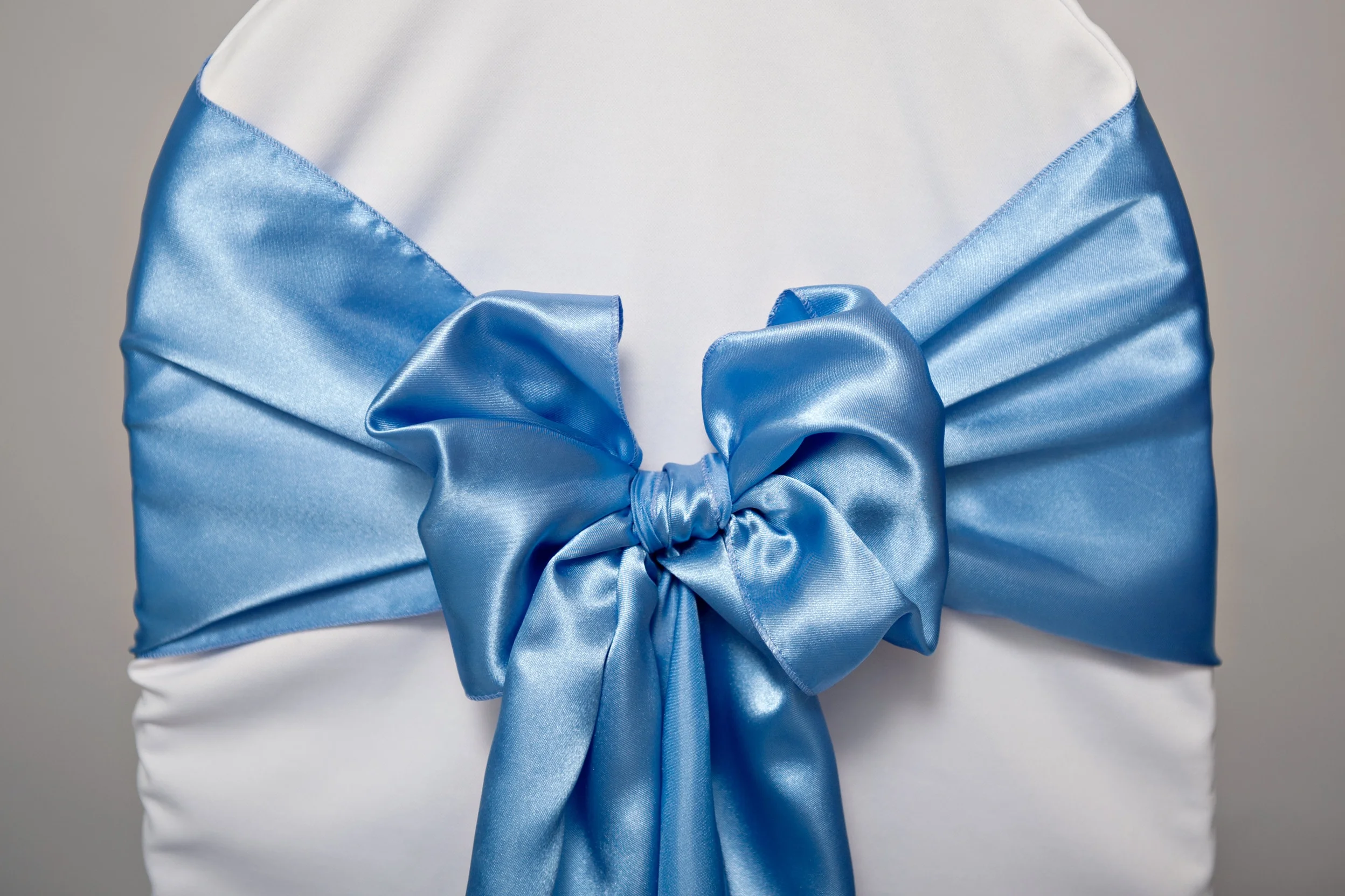 periwinkle satin sash tied in a bow
