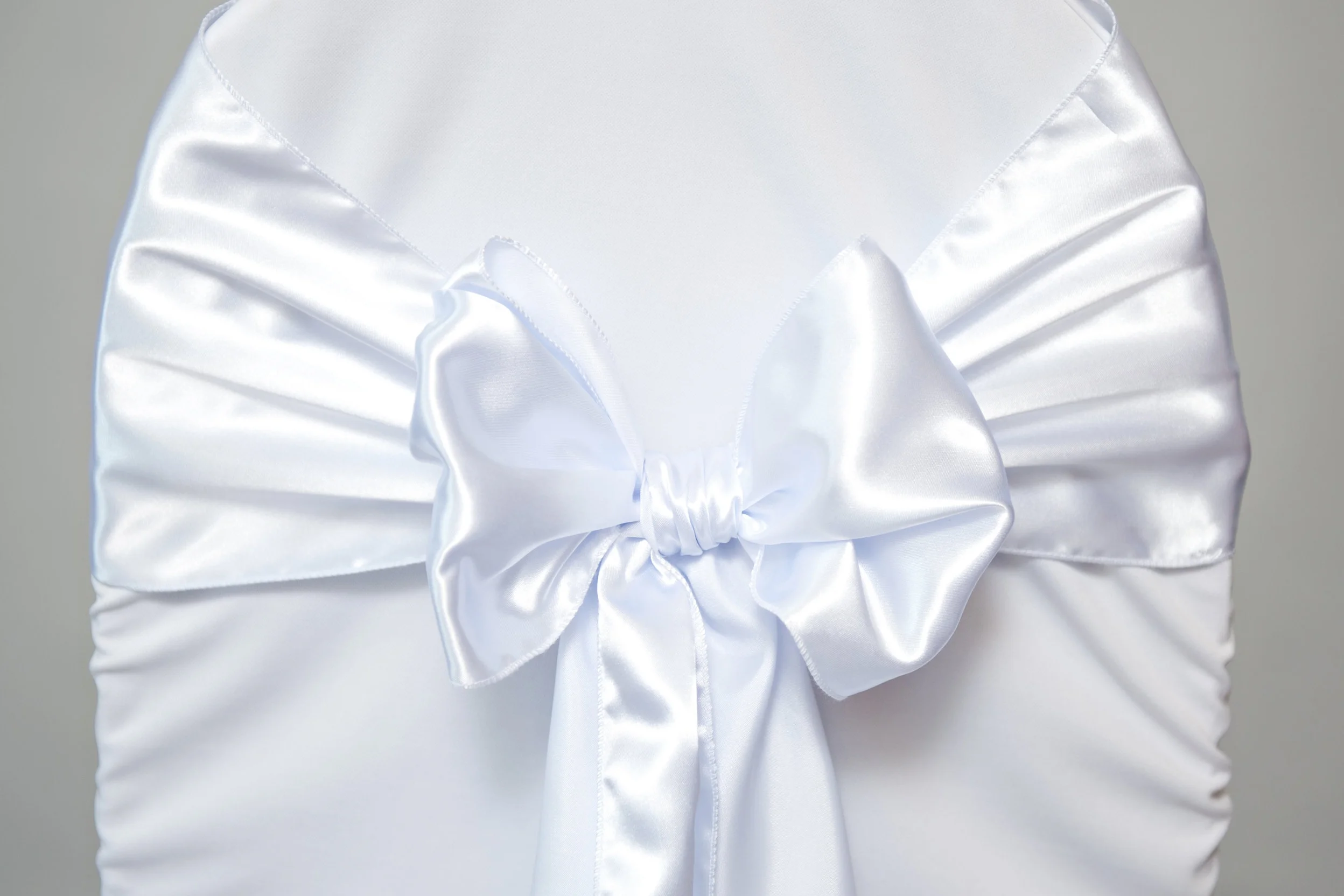 White Satin Sash tied in a bow