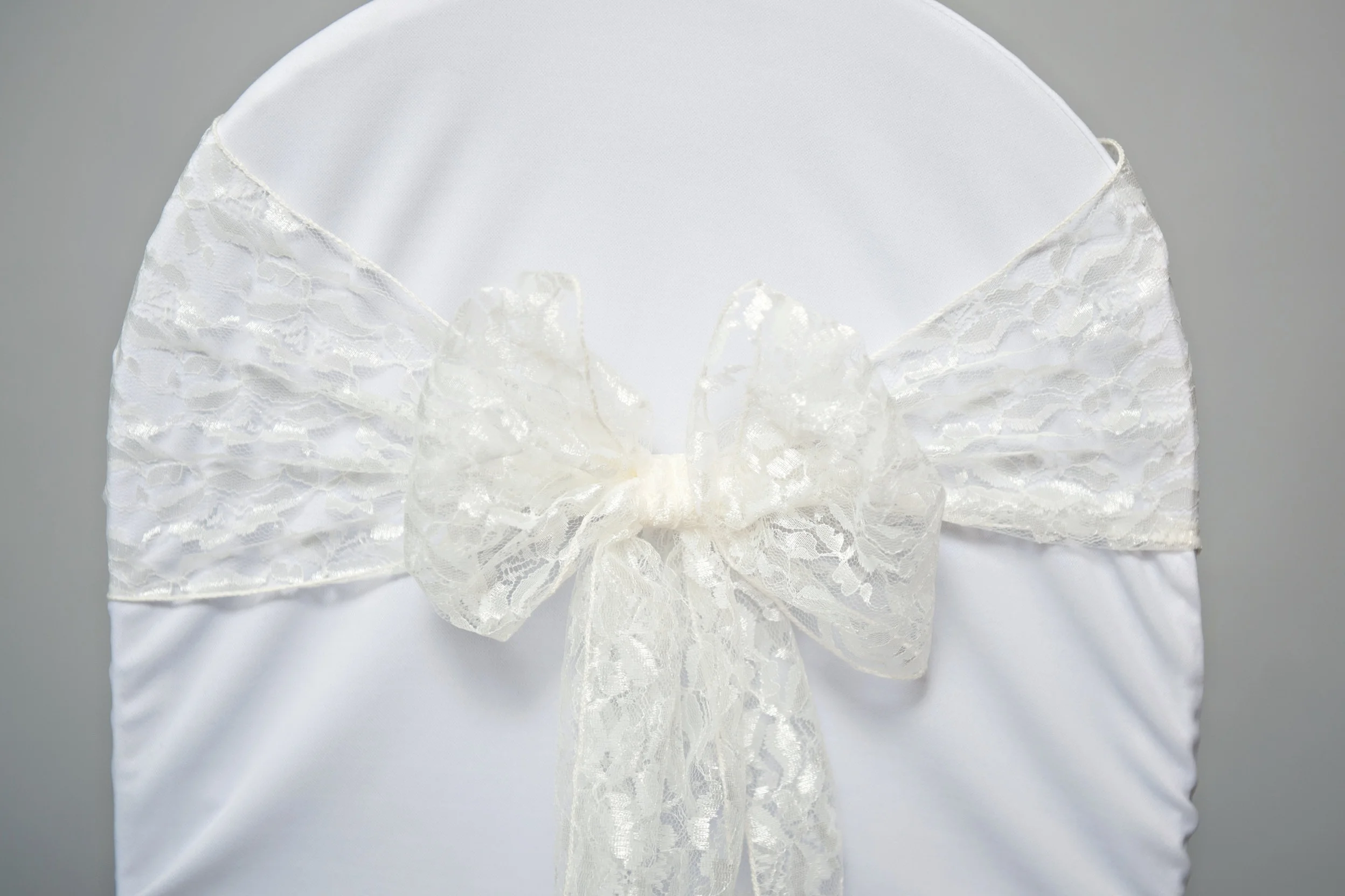 lace sash tied in a bow