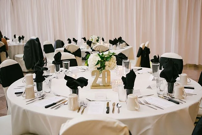 black napkins in glass at wedding reception
