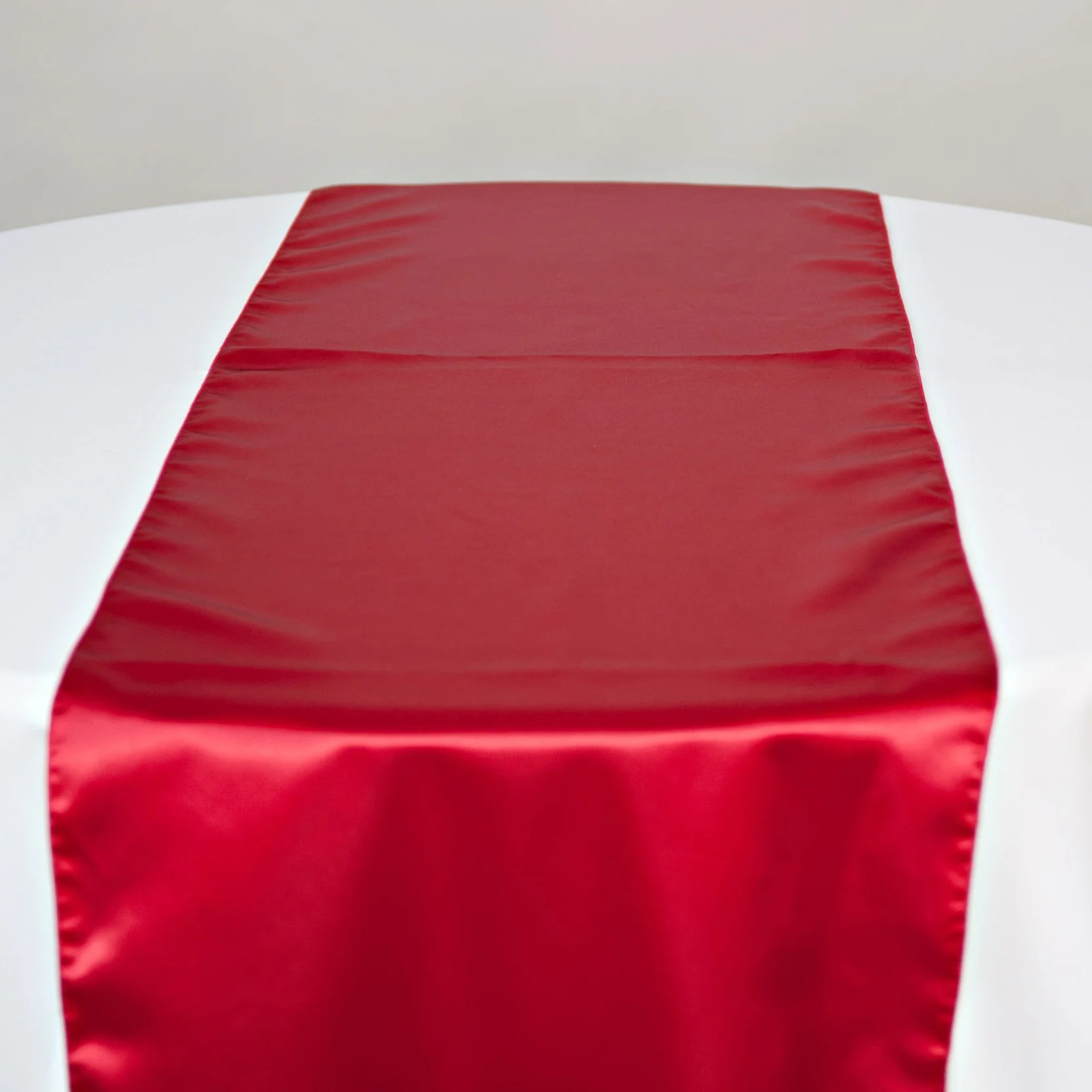 red satin table runner