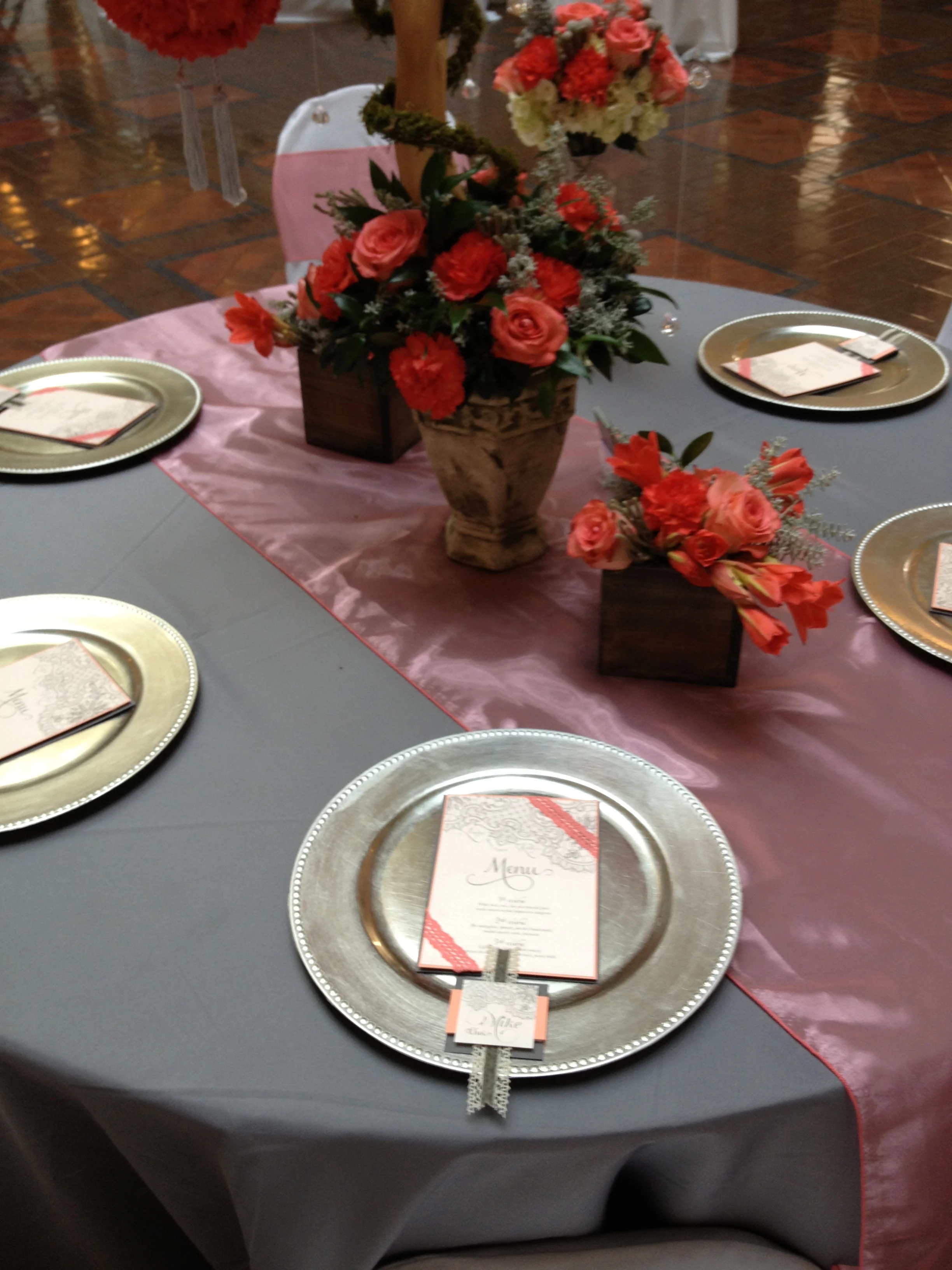 coral organza table runner on table with decor