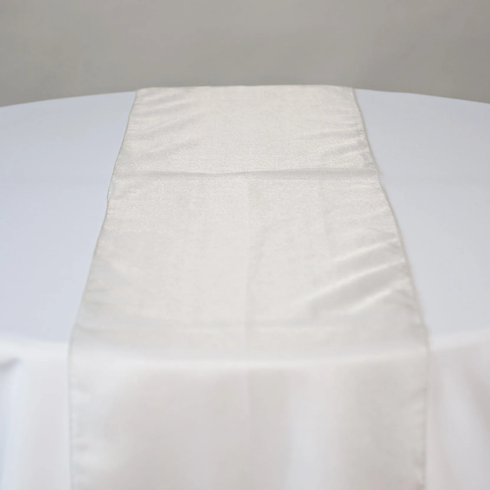 silver crystal organza table runner on table