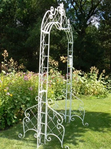 outdoor white metal arch for wedding ceremony