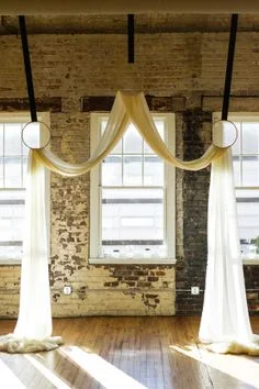 wedding ceremony draping hung from hoops