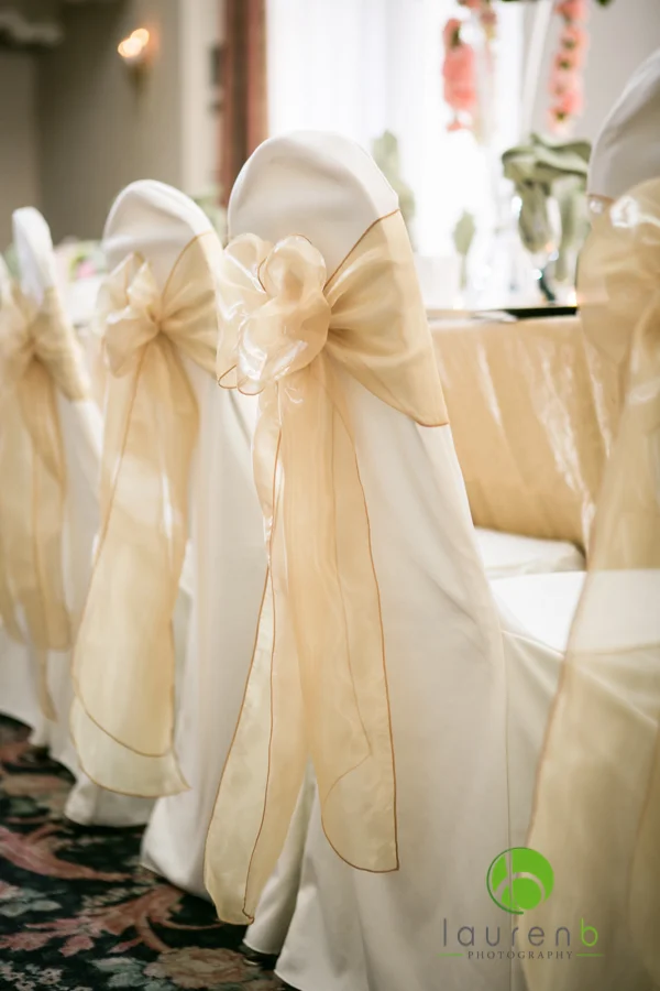 ivory chair cover with champagne sash