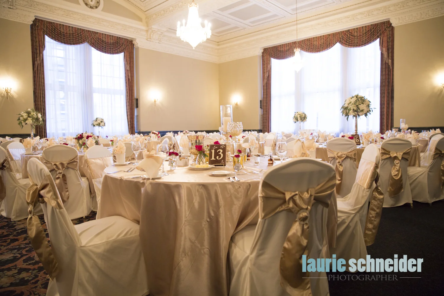 champagne satin sash at wedding reception with diamond buckles