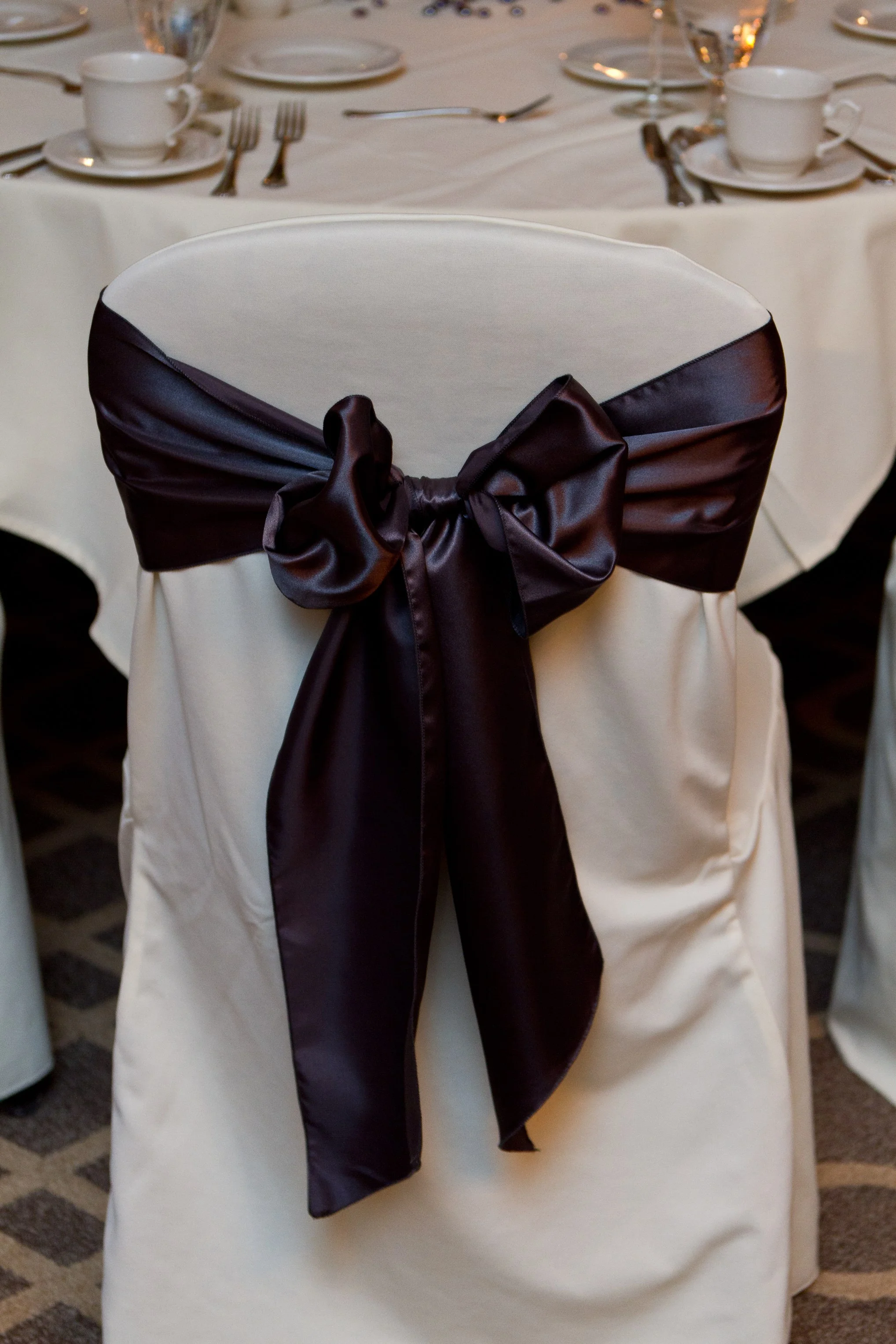 charcoal satin chair sash tied in a bow