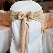 gold luster chair sash tied in a bow