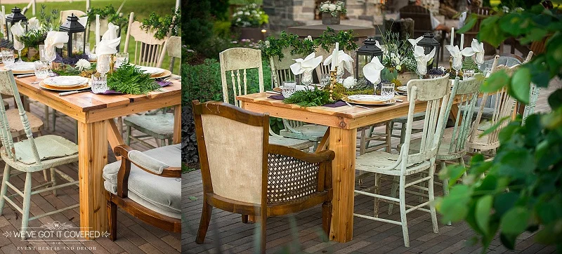 Farm table with unique chairs surrounding the table, and garland and lighthouses for the centerpiece.