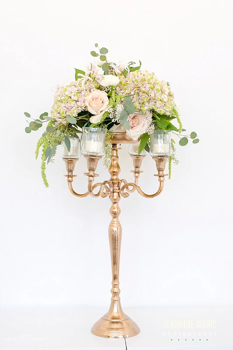 Gold candleabra used with floral plate and candles