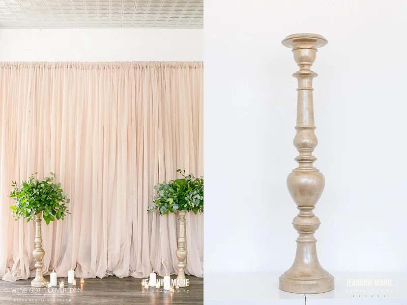 Taupe curtains used for a backdrop or draping at a wedding along with candlesticks used for added decoration