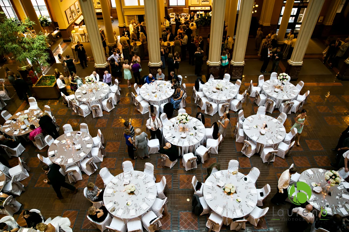 top view of silver colored table linens and white chair covers at a St. Paul wedding venue