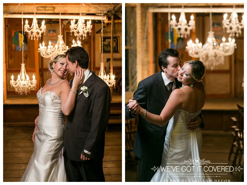 Kisses under a wall of chandeliers hung for extra romance