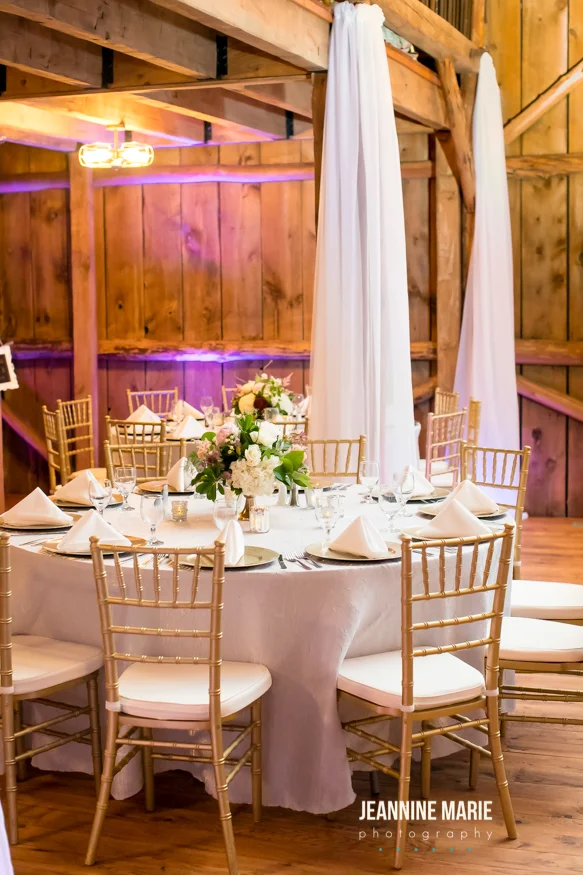 Wedding barn draping with silver linens and gold accents