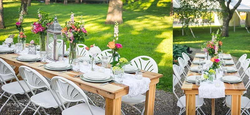 Simple and colorful outdoor wedding table idea with flowers, lanterns and table runners.