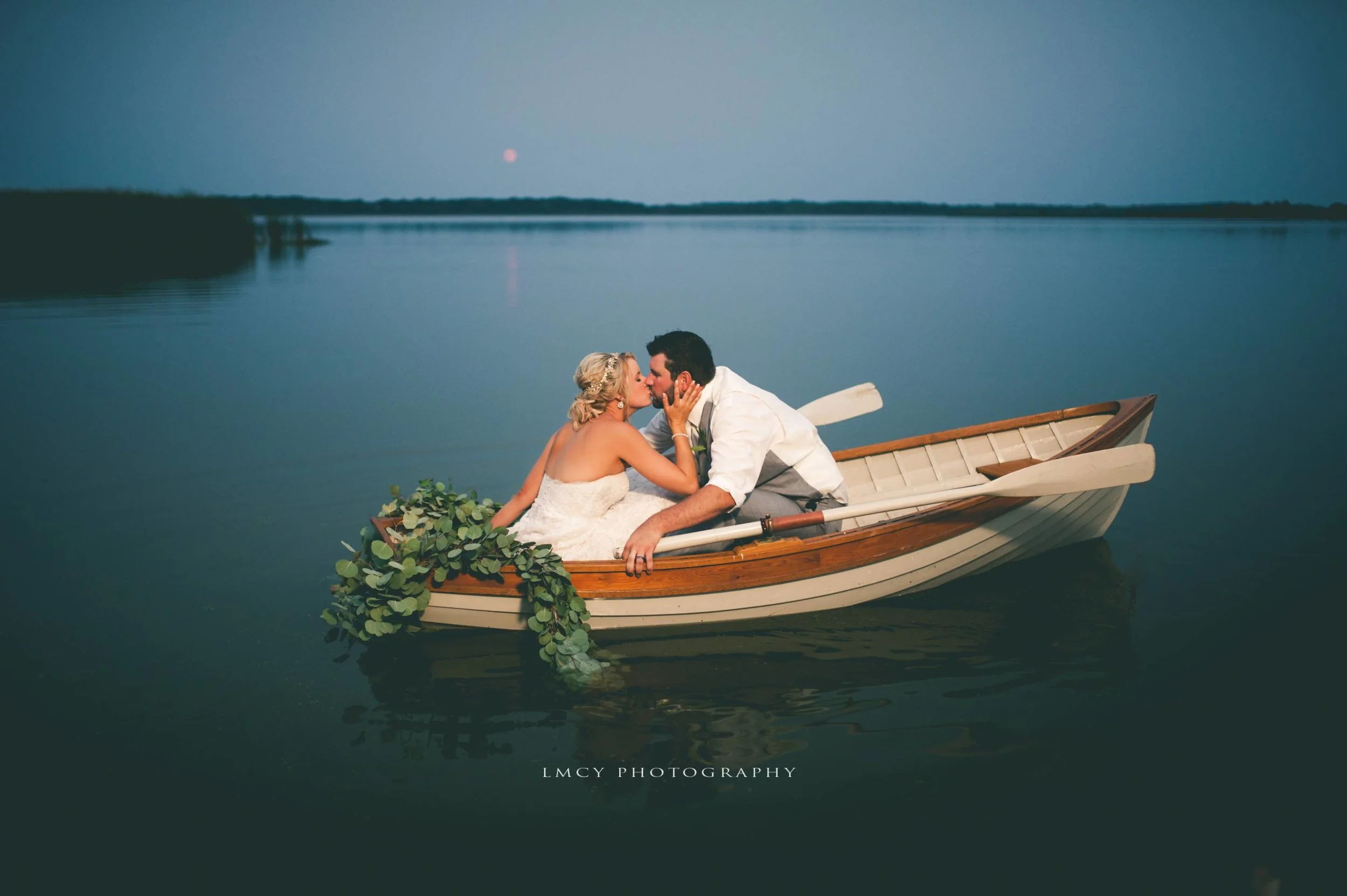 wedding day boat ride on a calm lake
