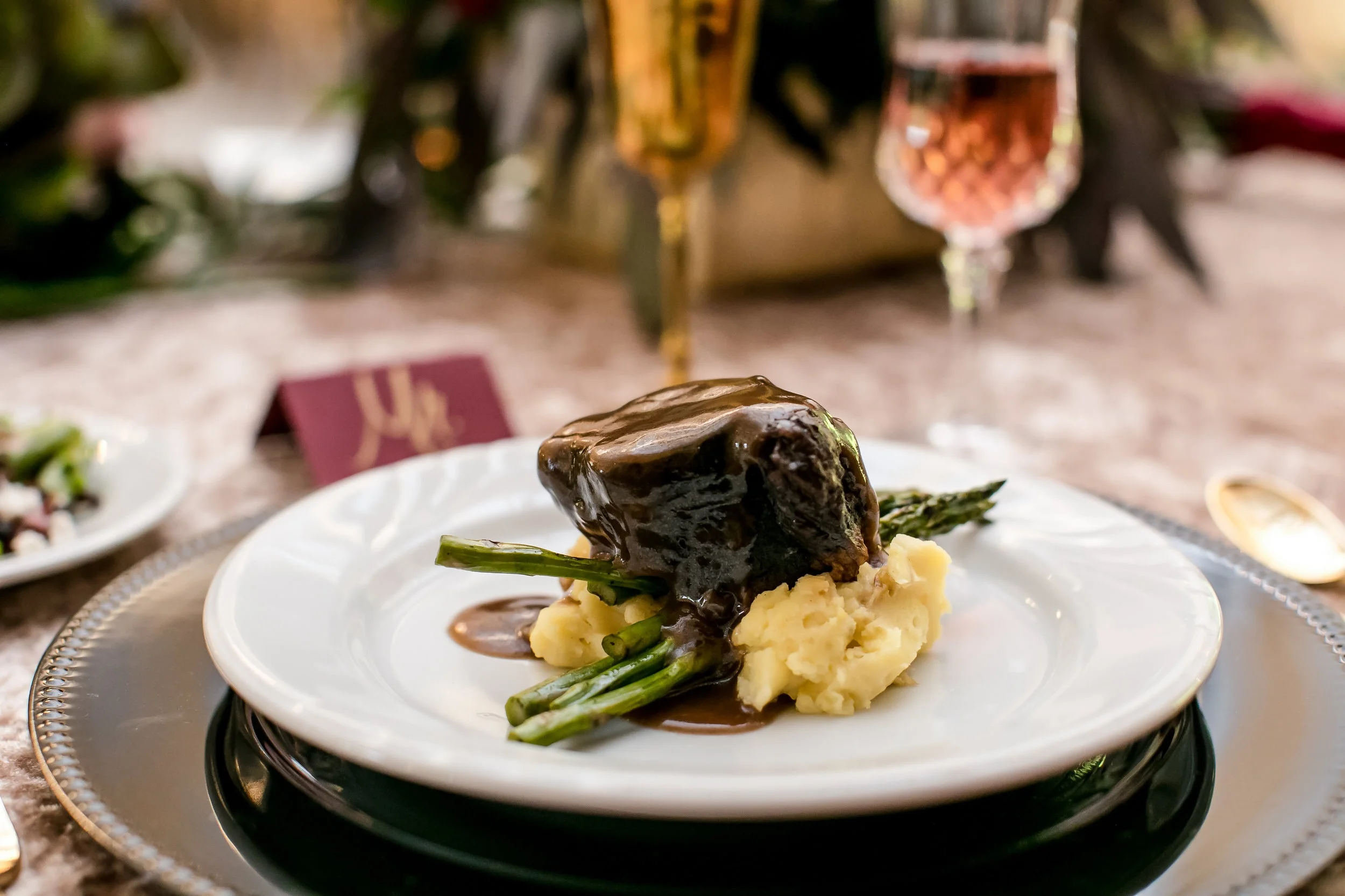 wedding dinner on black charger and velvet linen