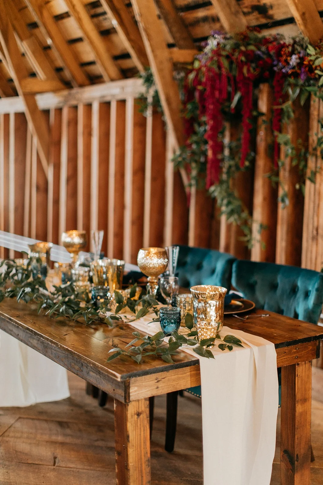 sweetheart table with ivory chiffon runner and gold goblets
