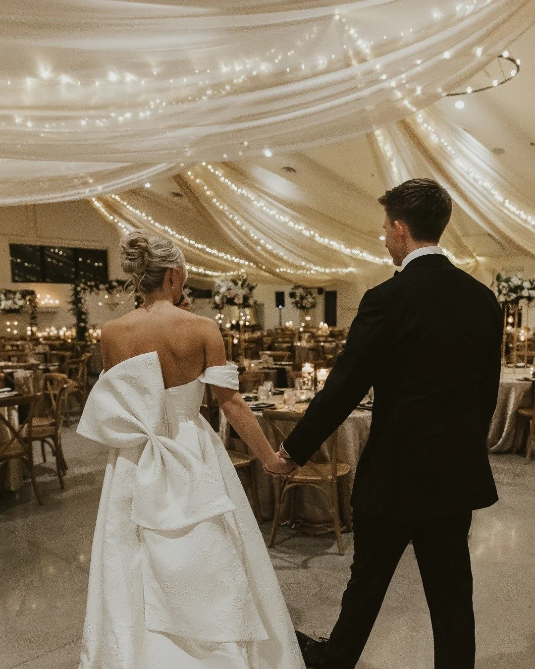 We don't just hang fabric; we install instant atmosphere and highly flattering lighting.

#weddinginspiration  #mnweddingdecor #twincitiesbride #minneapolis #minnesota #minneapolisevents #wedding #twincitieswedding #rattanlights #weddinglighting #wed