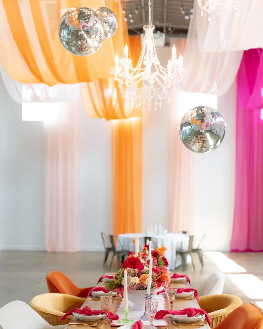 Why pick one vibe when you can have all the vibes? Our colorful draping, dazzling chandeliers, and sparkling disco balls said, "Let's party!" ✨🌈

#weddinginspiration  #mnweddingdecor #twincitiesbride #minneapolis #minnesota #minneapoliseve
