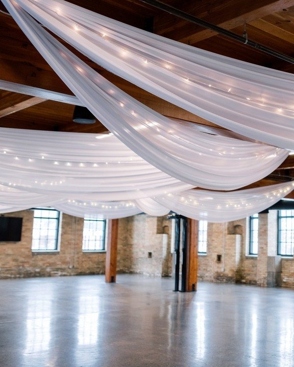 Create a cozy and romantic atmosphere with ceiling draping that adds warmth and intimacy to your wedding reception.

#weddinginspiration #cafelights #mnweddingdecor 
#twincitiesbride #minneapolis #minnesota #minneapolisevents #wedding #twincitieswedd