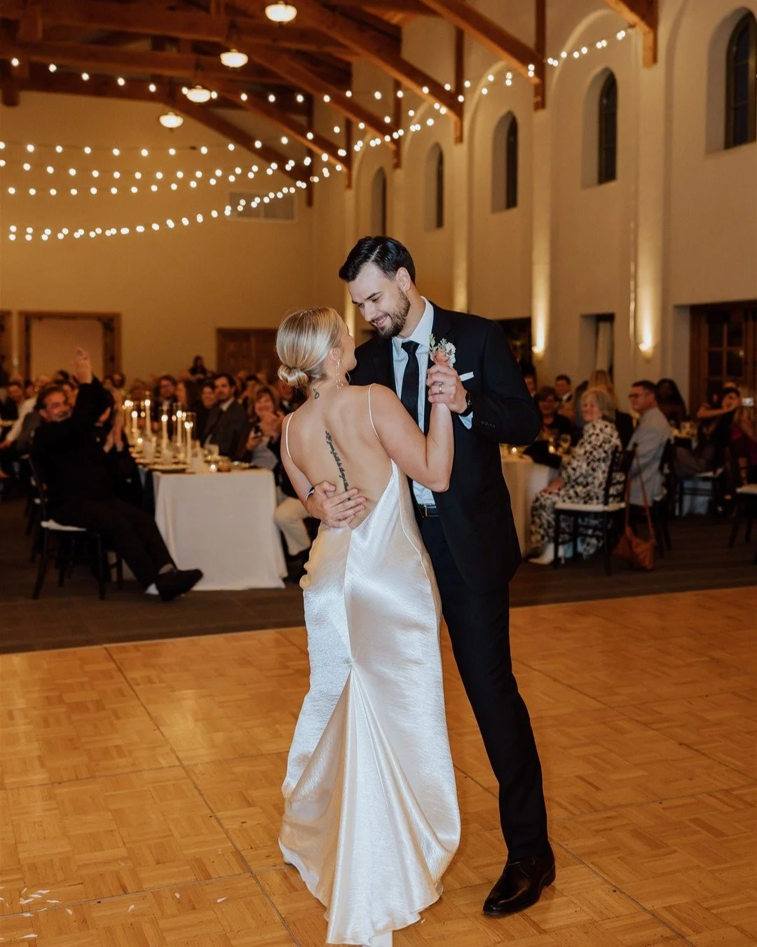 The only thing better than the happy couple? The flattering glow these string lights cast on absolutely everyone.