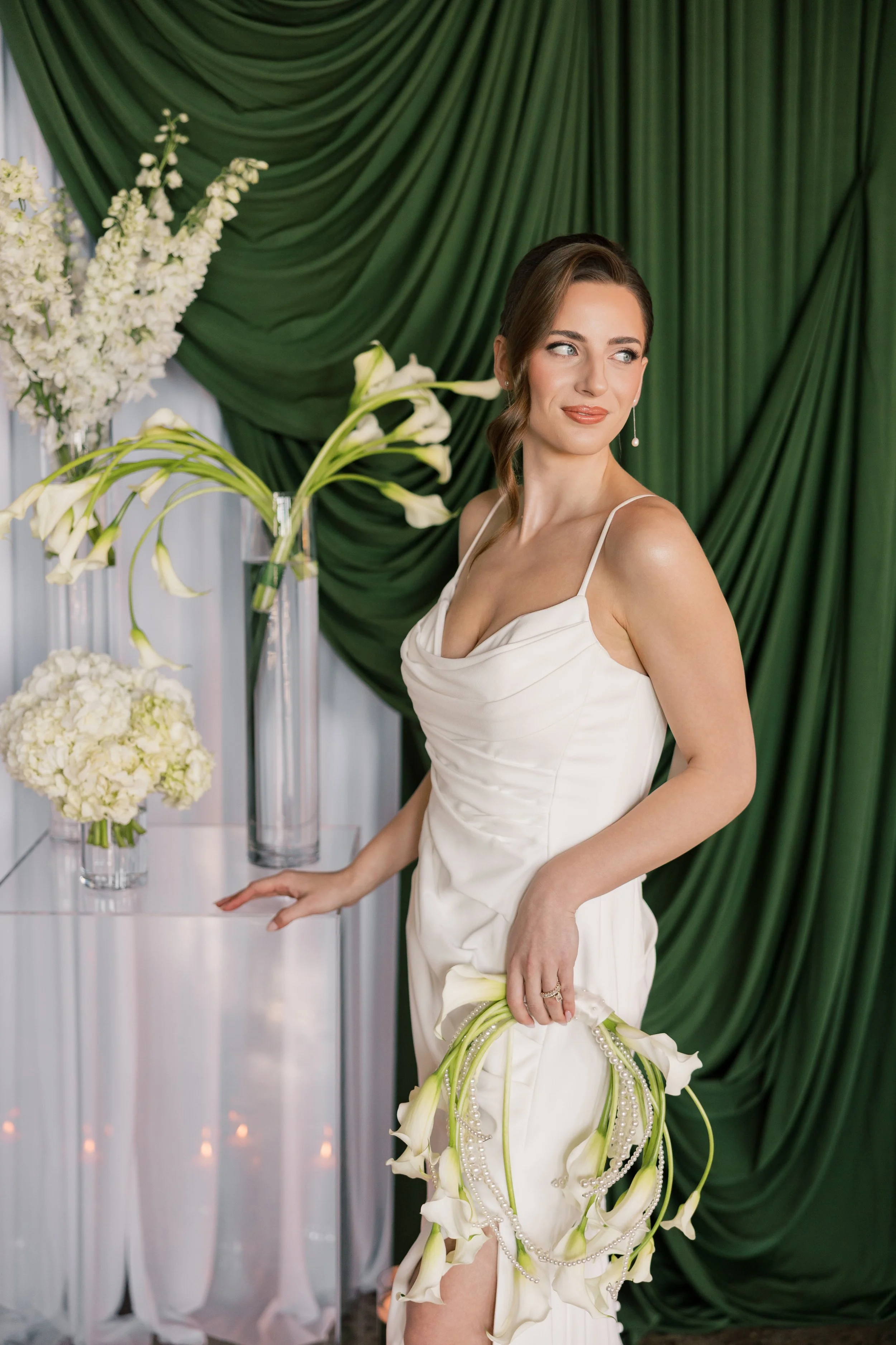 essence Event Center |Ethereal fabric draping with greenery accents for a romantic sweetheart table.