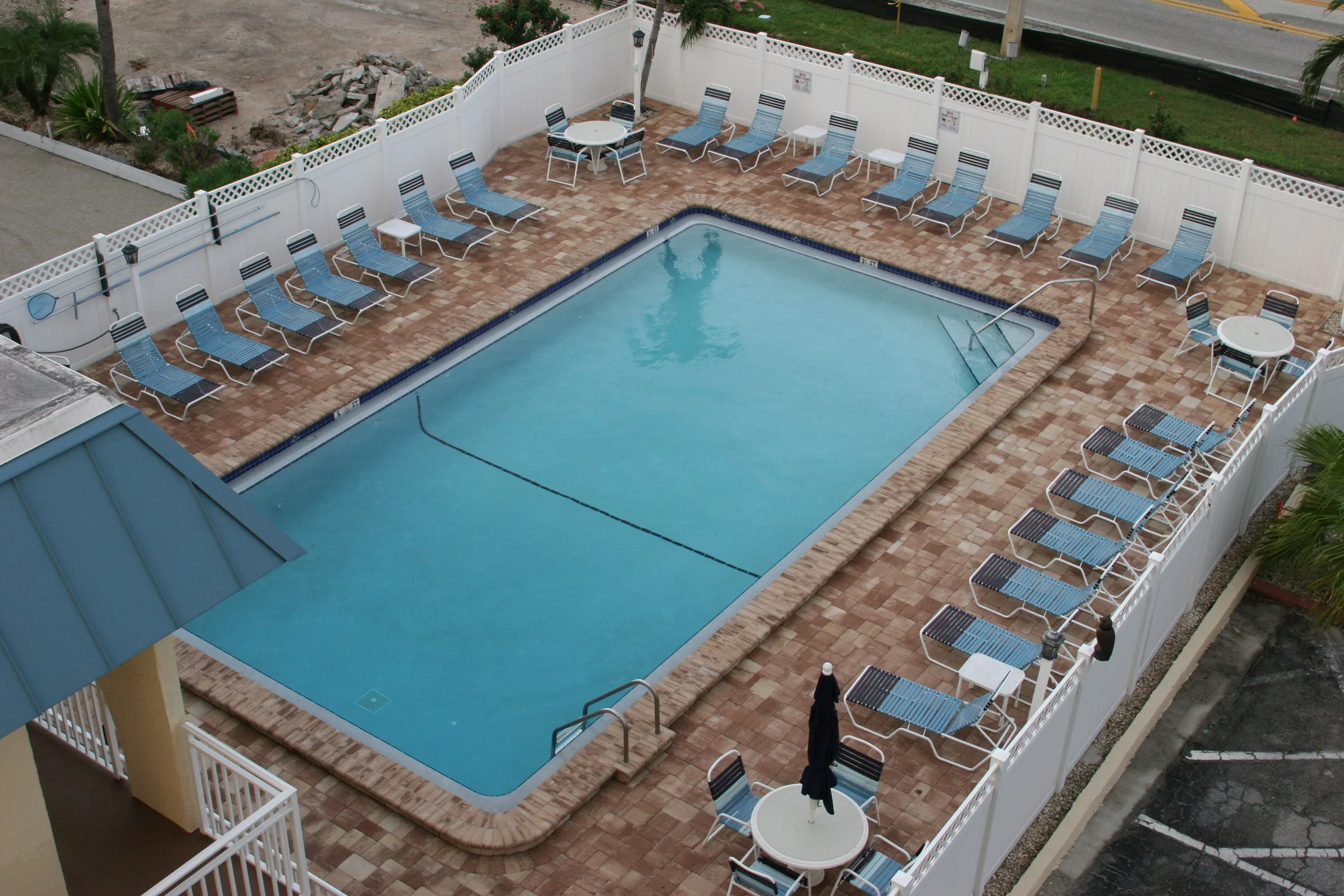 Newly remodeled pool with privacy fence and plenty of seating. Heated in the winter