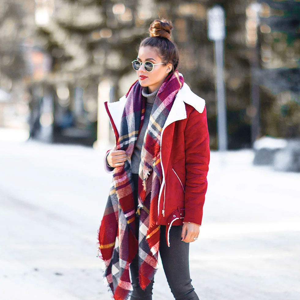 Festive Red Winter Outfit featuring Shearling Jacket and plaid scarf in Whistler Canada