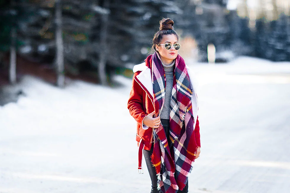 Festive Red Winter Outfit featuring Shearling Jacket and plaid scarf in Whistler Canada