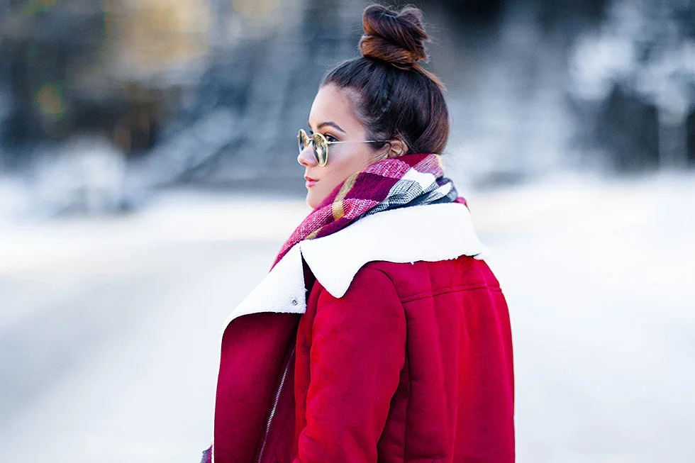 Festive Red Winter Outfit featuring Shearling Jacket and plaid scarf in Whistler Canada